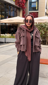 Cropped fur jacket in a brown color.