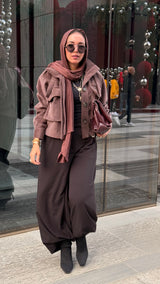 Cropped fur jacket in a brown color.