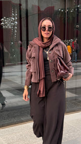 Cropped fur jacket in a brown color.