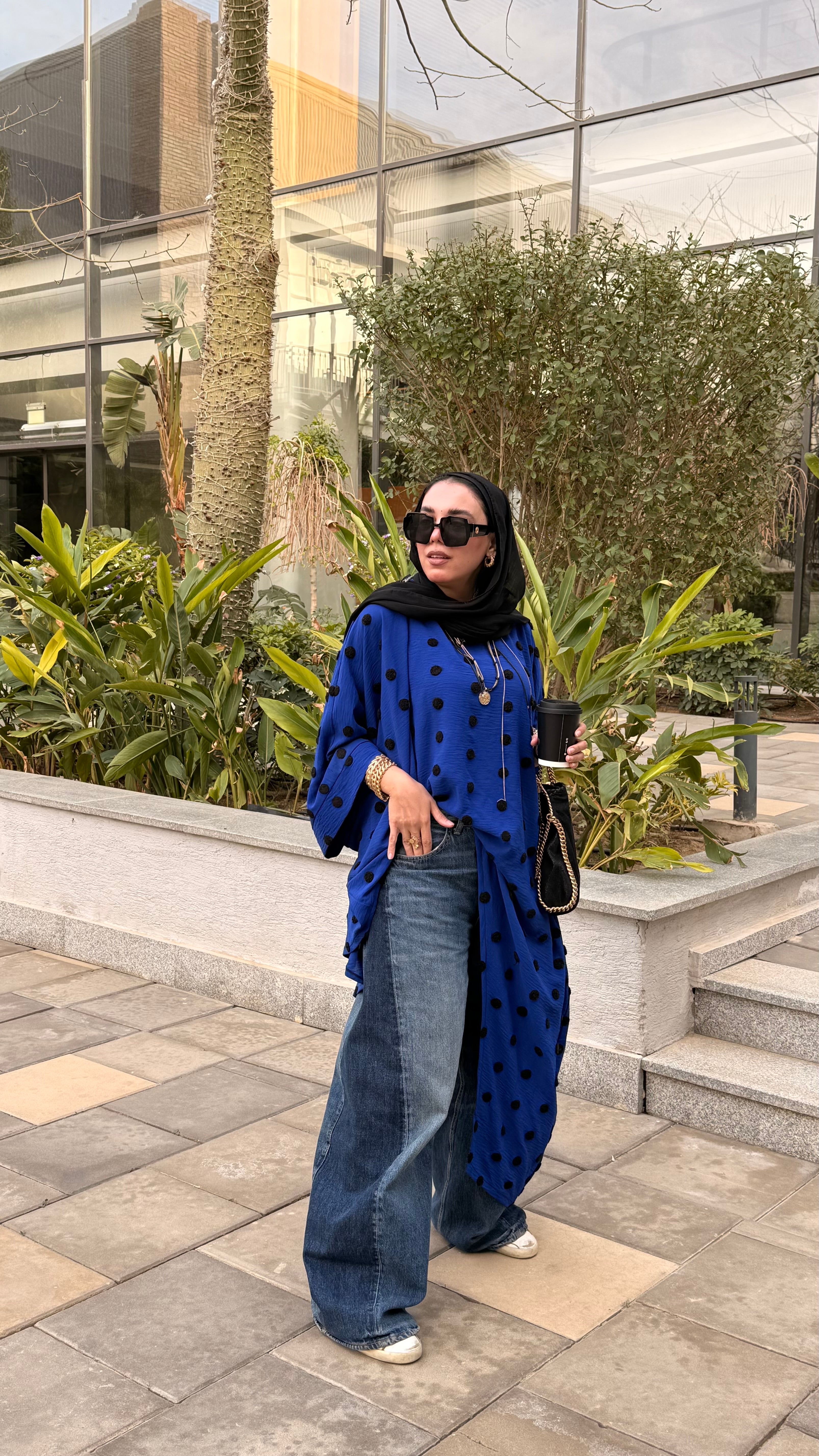 Polka dot symmetrical poncho.