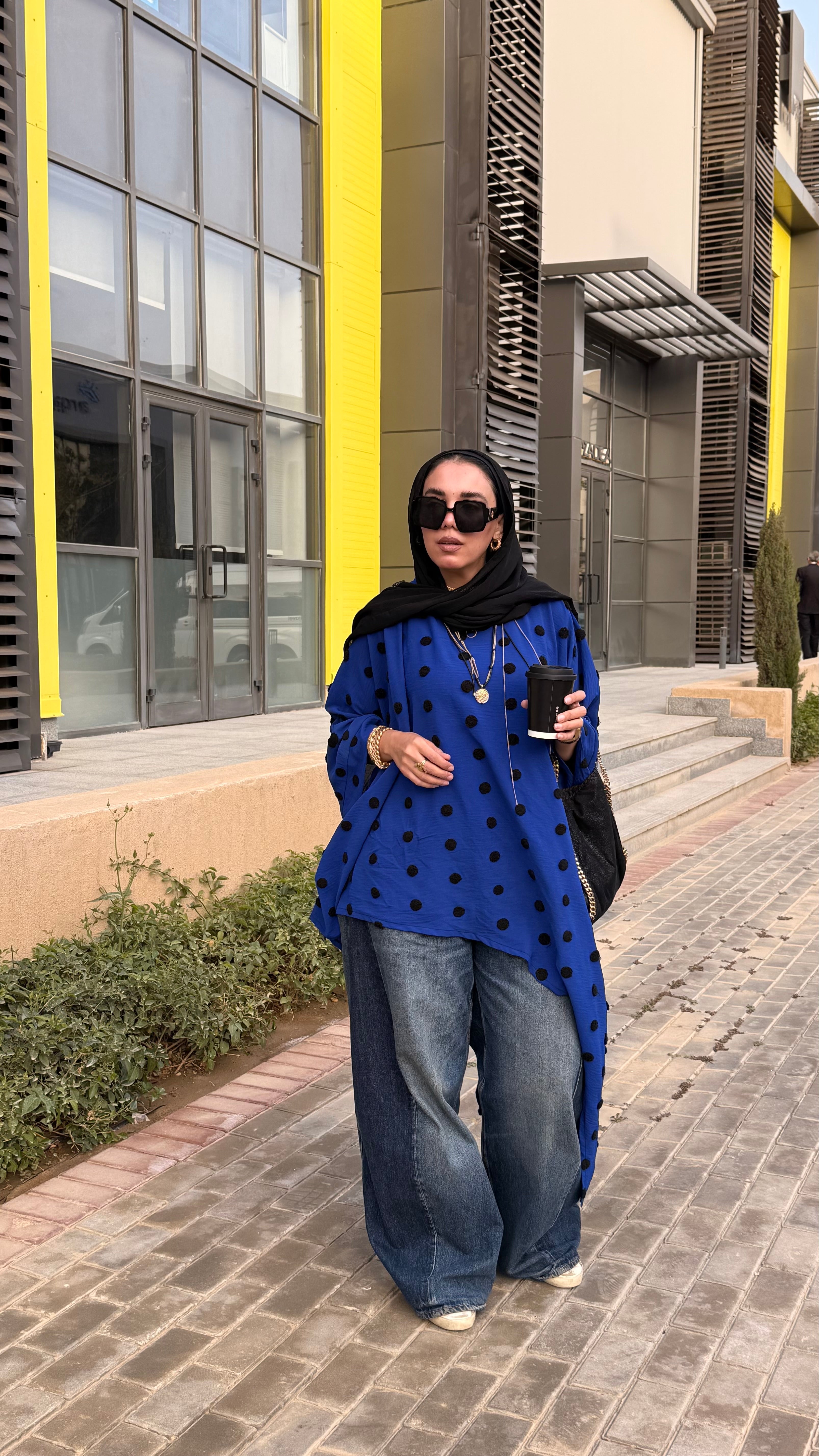 Polka dot symmetrical poncho.